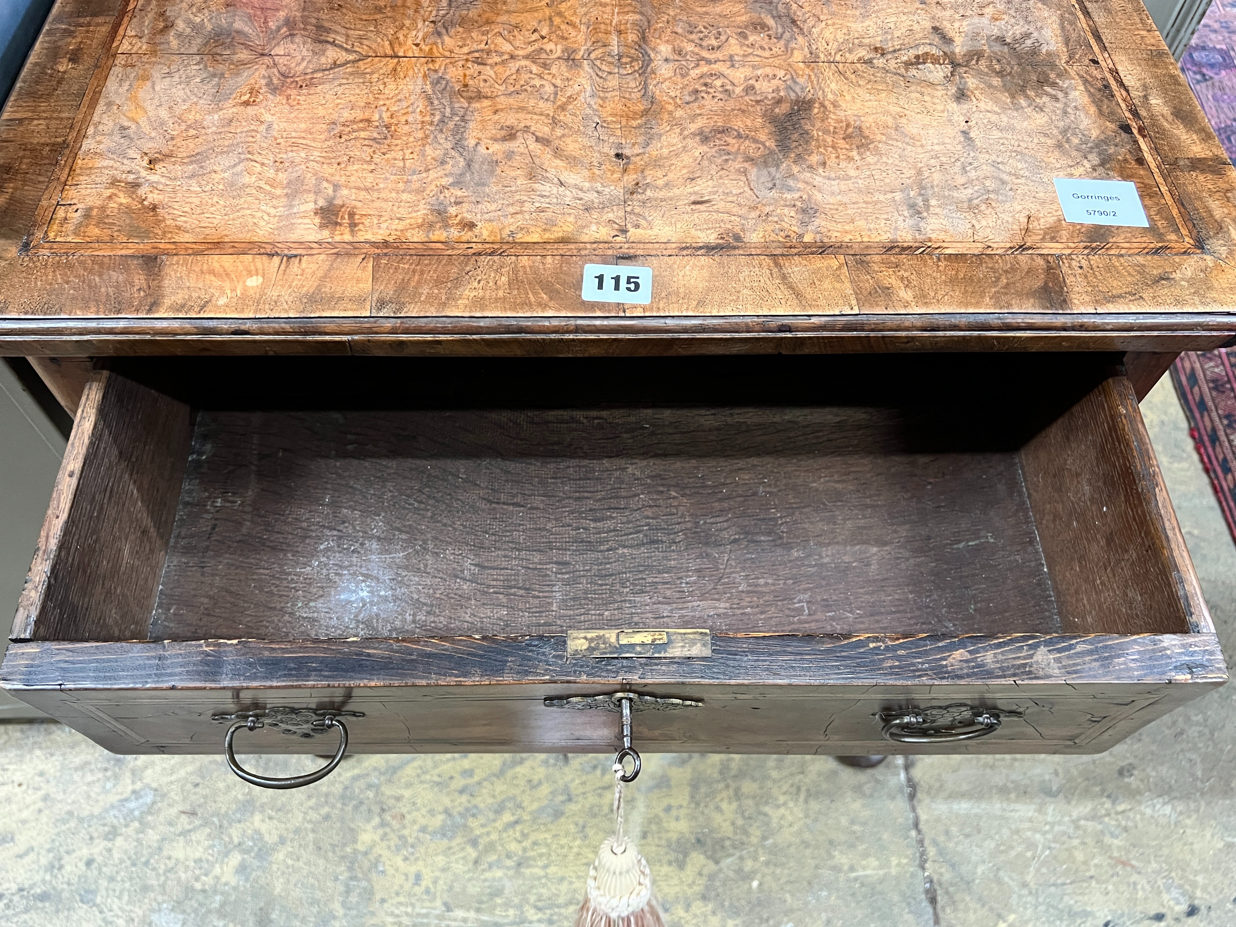 A small 18th century feather banded figured walnut veneered lowboy, width 64cm, depth 46cm, height 71cm